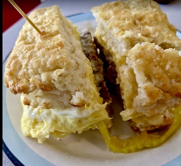Biscuit sandwich with sausage and egg at Molly's, a place for Good Eats in The Big Easy