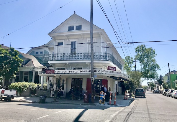 Large white house on a corner with restaurant ground level is just one place for Good Eats in The Big Easy