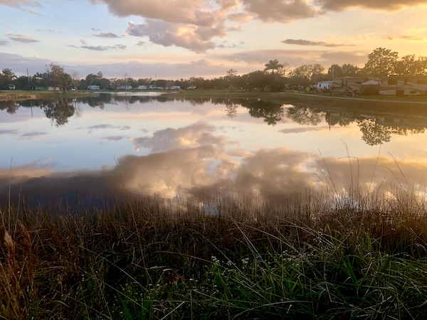Pink and lavender clouds reflecting in the lake at our RV park.