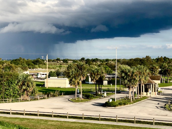 Storm clouds with rain in distance by an RV park on Lake Okeechobee Florida