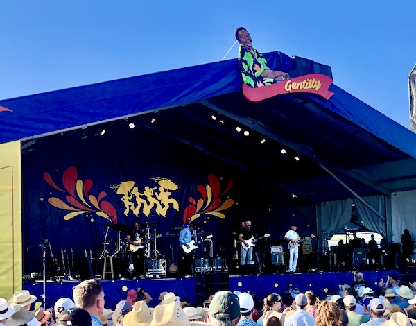 Kenny Loggins and his band performing at the Gentilly Stage at New Orleans Jazz and Heritage Festival
