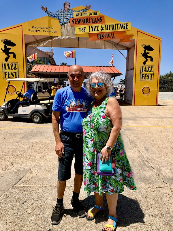 Steve and I standing at the entrance to the 2023 New Orleans Jazz and Heritage Festival
