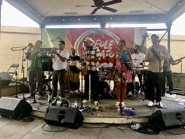 10 piece band performing on stage at the 37th Creole Tomato Festival NOLA