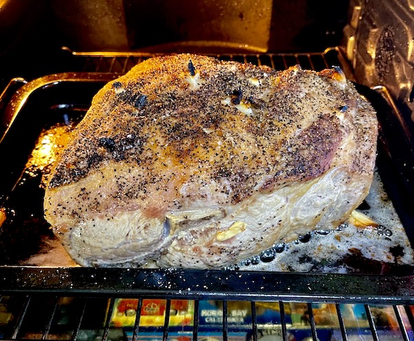 Golden brown pork butt in the oven almost ready to be Easy Alabama Pulled Pork