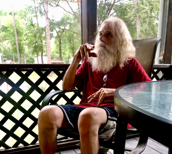 Man in red shirt who looks just like Santa Clause at our first stop from NOLA to Lake Worth Florida