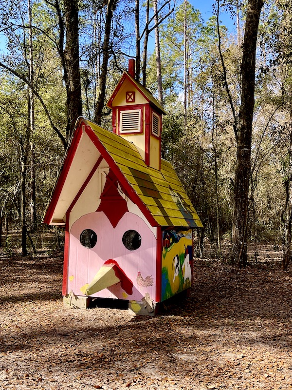 Tiny pink and red house at our second stop from NOLA to Lake Worth Florida