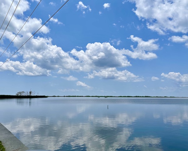 Clouds reflected in still water on our Sunday Drive to Louisiana Southernmost Point