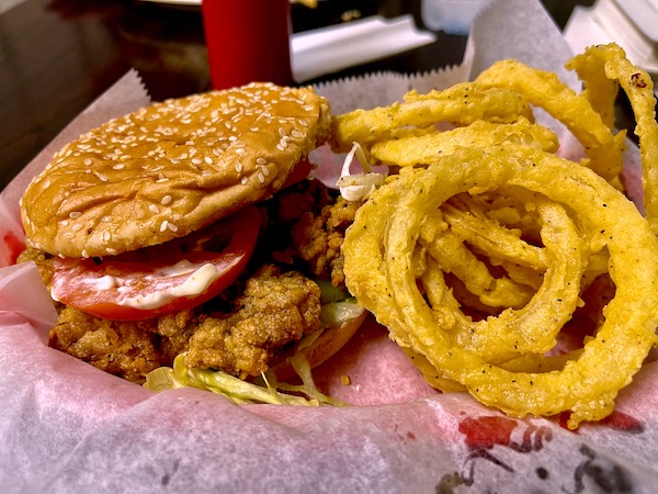 Basket of fried oysters on a bun with battered onion rings for lunch of our Sunday Drive to Louisiana Southernmost Point