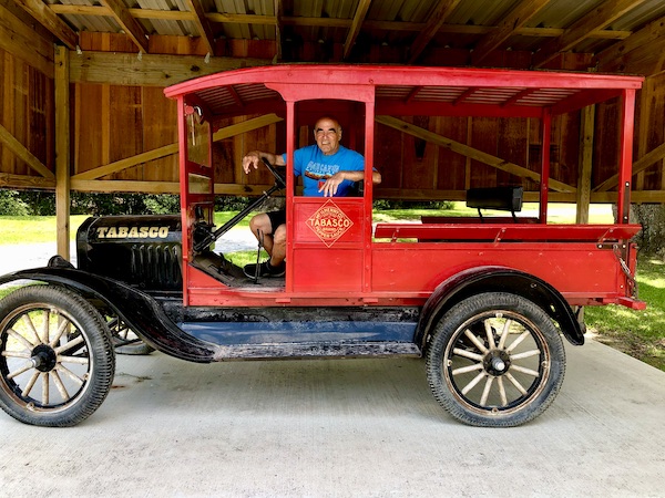Steve behind the wheel of a Model T truck during our Tabasco Avery Island Experience