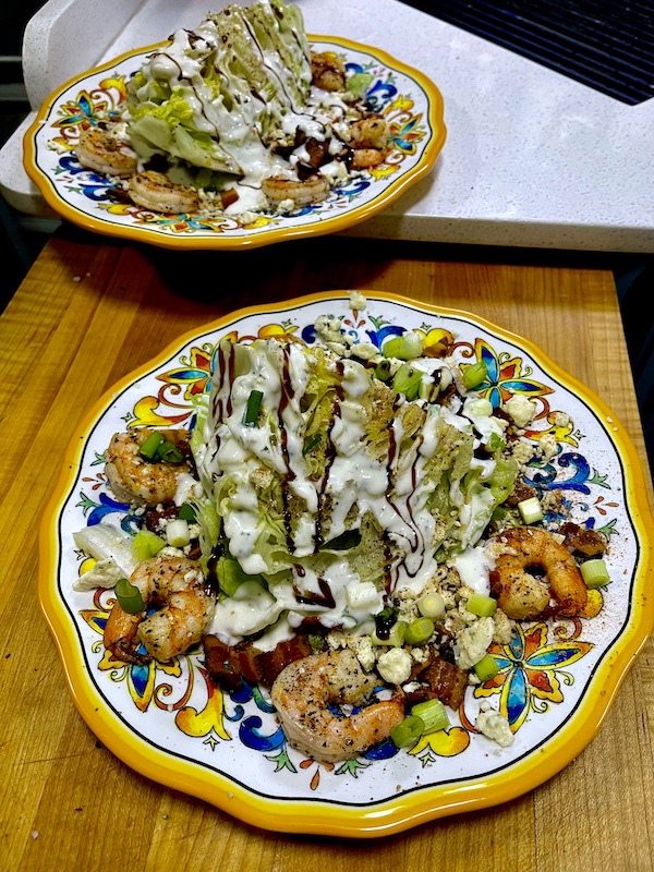 Two plates of The Wedge Salad Cajun Style.