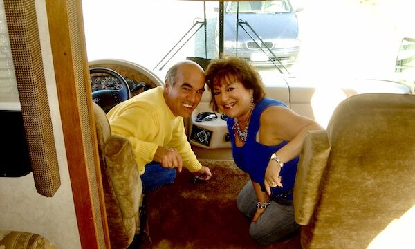 Guide to Full Time RV Living Part 1 with us in the driver and passenger seats of our first RV