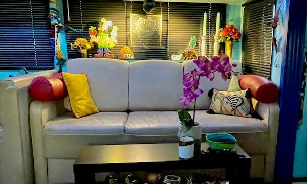 Beige leather sofa and lots of knick knacks make this RV feel like home. It's part of our Guide to Full Time RV Living Part 2