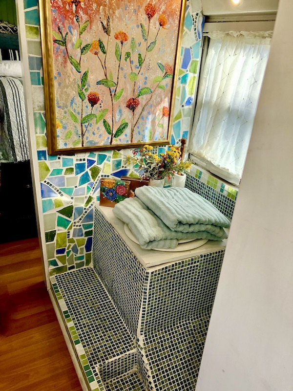 Mosaic tiles, artwork and towels show How to Make Your RV Feel Like Home