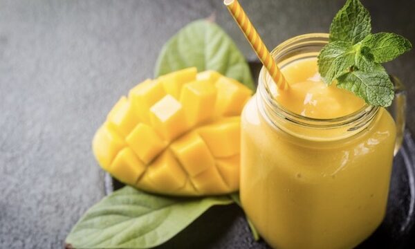 Tasting Arizona Chilled Mango Soup in a Mason Jar garnished with mint and served with a straw.