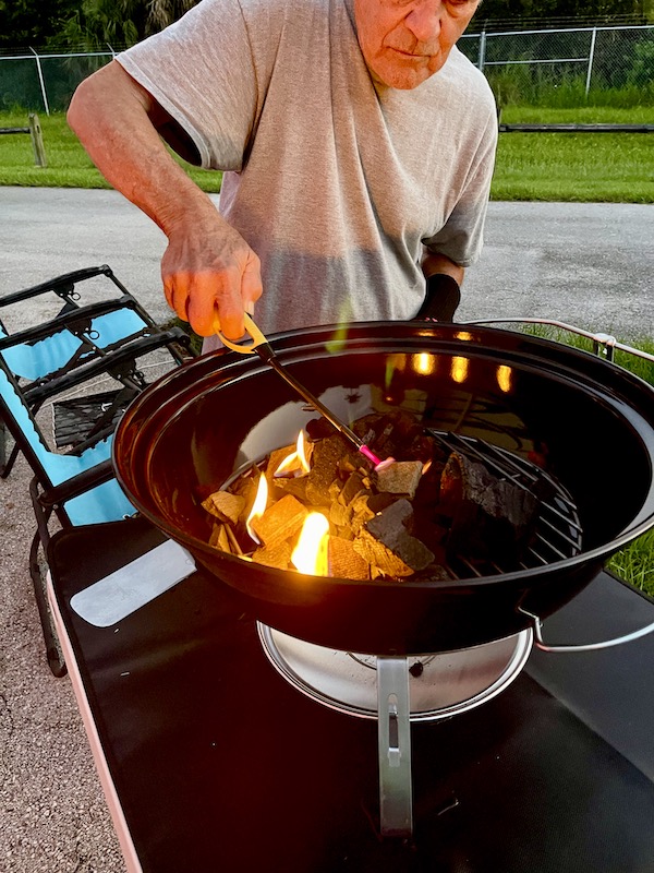 Steve continues to light the remaining fire starter squares.