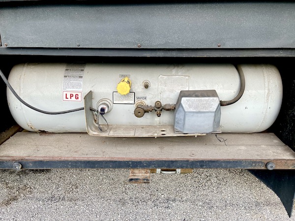 A large RV propane tank is visible and part of Pre-Trip Checklist for Motorhomes