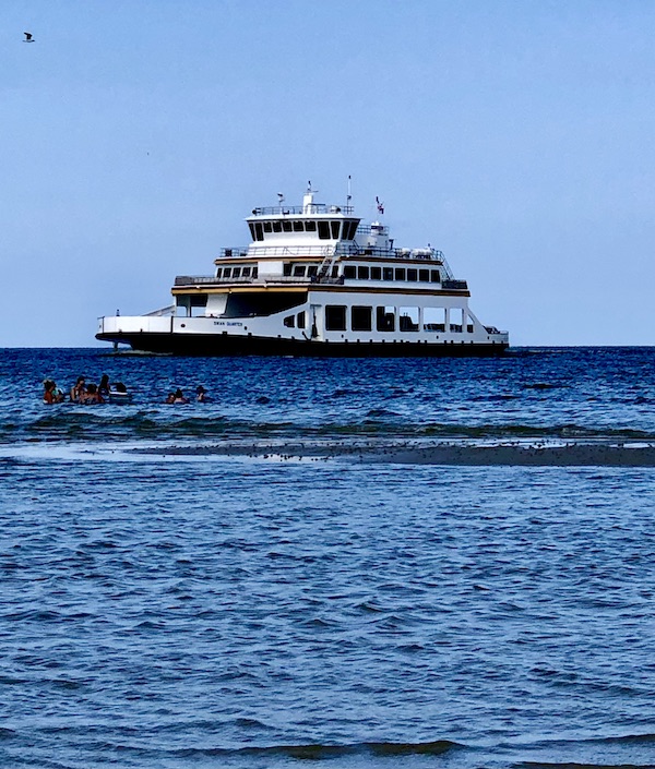 Large navy blue and white ferry boat on the water. Part of my 3 Years RVing Year 1 Recap