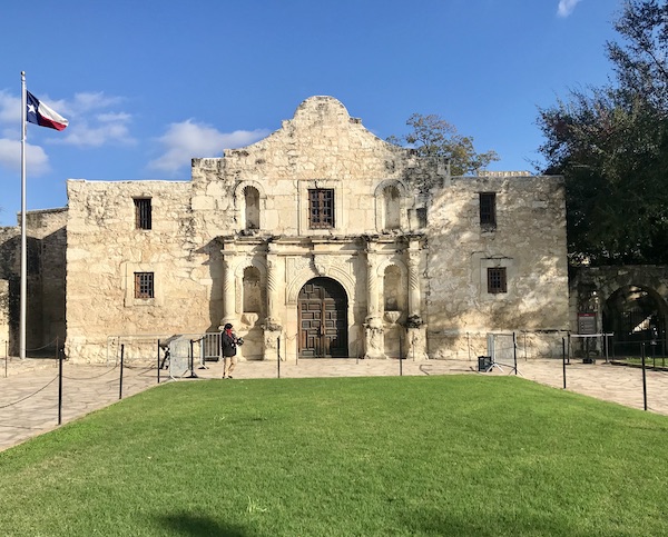 Large stone building is the Alamo in San Antonio TX.