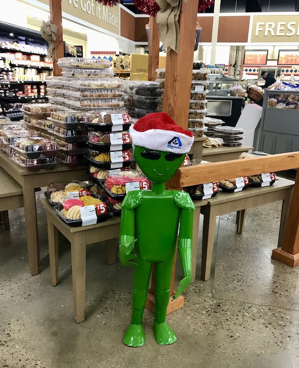 Little green man with Santa cap at a supermarket in Roswell NM
