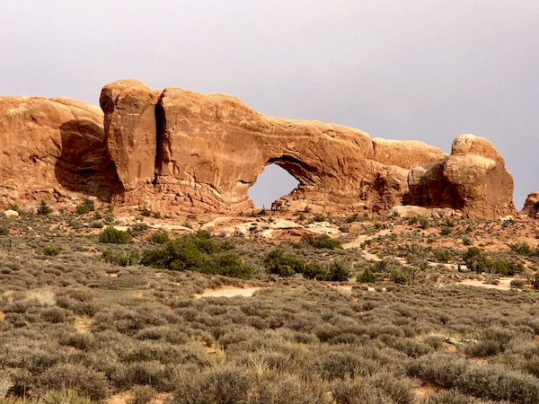 Rock formation with hole showing sky at Arches National Park in Moab UT and part of my 3 Years RVing Year 1 Recap