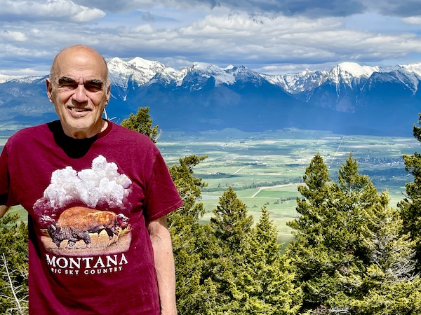 Steve standing on a plateau with the Grand Tetons in the background. 3 Years RVing Year 3 Recap