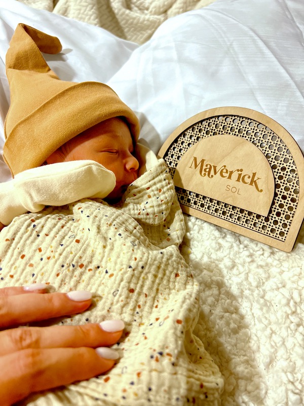 Infant with gold sky cap and name sign. Part of my 3 Years RVing Year 3 Recap