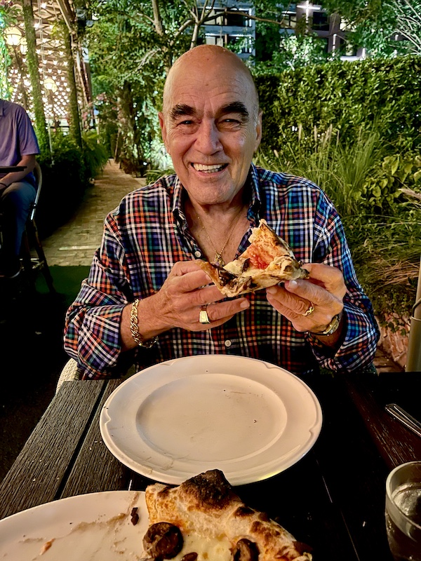 Steve about to eat a slice of pizza at Elisabetta's Ristorante Bar Pizzeria 