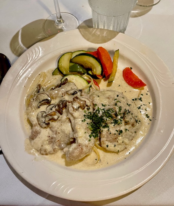 Veal scallops in creamy sauce with mushrooms and vegetable medley at Stresa Italian Restaurant WPB FL