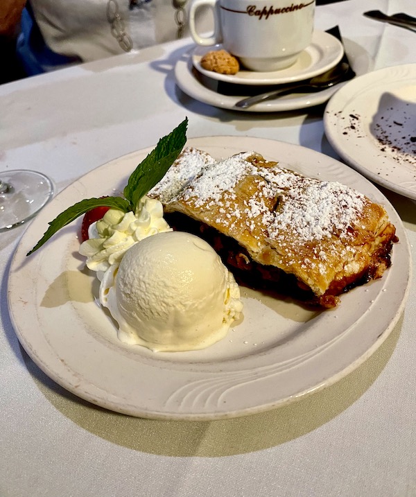 Slice of apple pastry with 2 scoops of vanilla ice cream at Stresa Italian Restaurant WPB FL