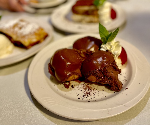 A trio of chocolate covered cream puffs served at Stresa Italian Restaurant WPB FL