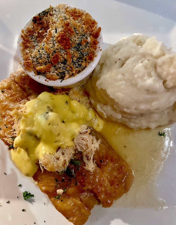 Locally caught Yellowtail Snapper topped with luscious Lump Crabmeat and Béarnaise ASauce with sides of Creamy Mashed Potatoes and Spinach Maria