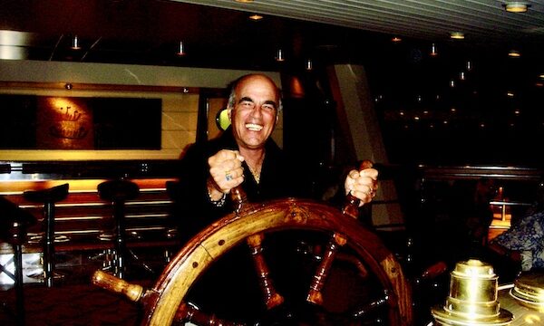 Steve at the ships wheel pretending to steer the ship.