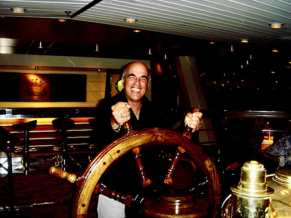 Steve at the ships wheel pretending to steer the ship.