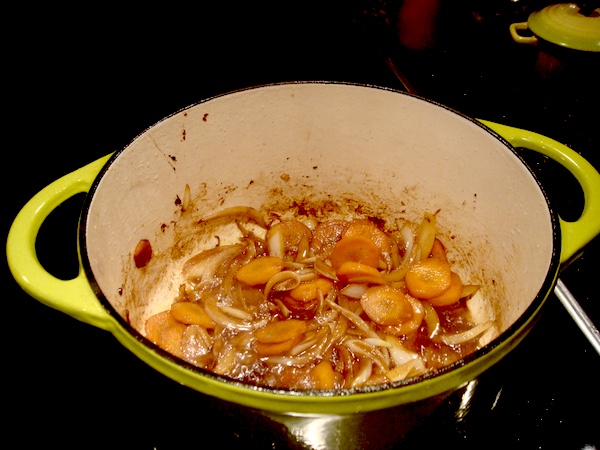 Green Dutch oven on the stovetop with carrots and onions cooking, part of my Homage to Julia Child