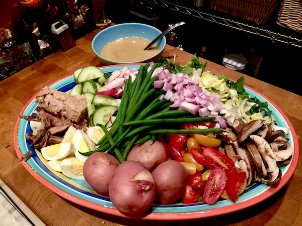 I Love to Feed People a platter of tuna, eggs, potatoes and vegetables.
