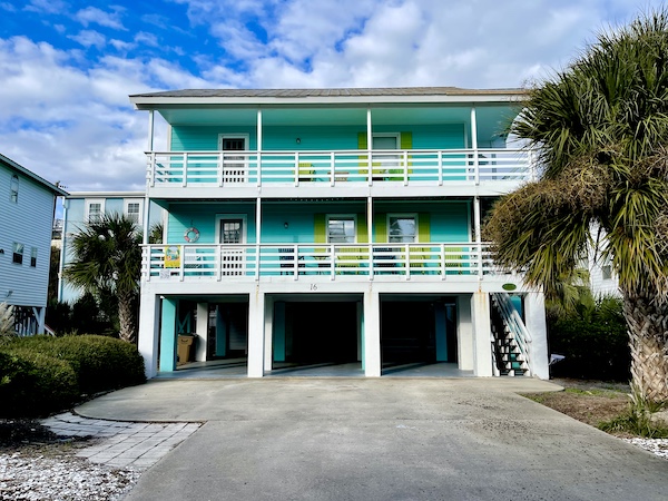 Turquoise house with lime green shutters and white trim on Tybee Island Georgia