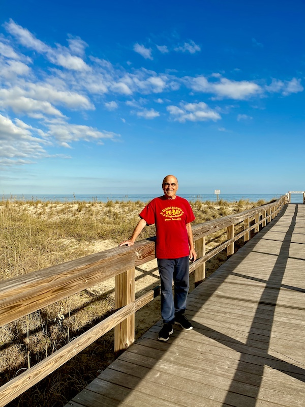 Steve in a red T-shirt at the beach access to Tybee Island Georgia