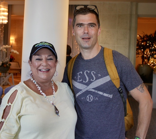 Me in a pale yellow top with male chef in navy. the chef is the owner of Five and Ten Athens GA