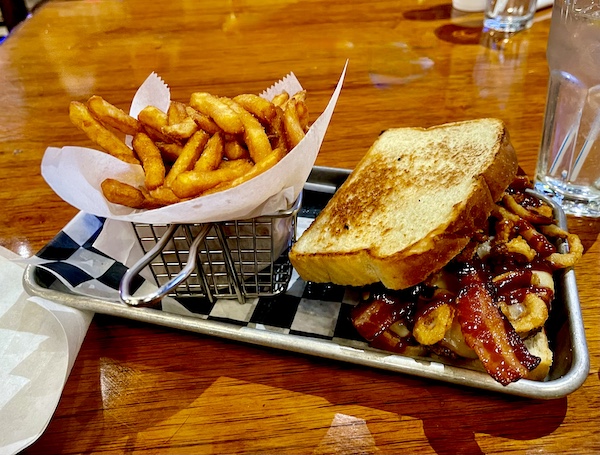 Bacon Burger on grilled bread with basket of fries was a dinner while spending the Holiday Season in Helen Georgia