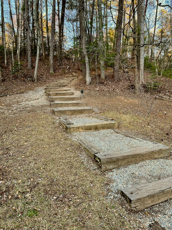 Holiday Season in Helen Georgia at a park with a path of steps leading to the trees.