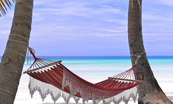 Barbados Bound: Guide to Ultimate Girl Gang Getaway hammock at the beach with sand and ocean.