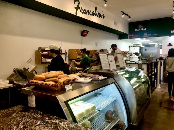 Francolini's Italian Deli NOLA deli counter and cases with staff