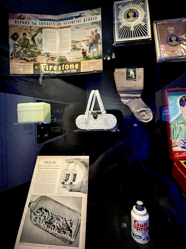 Items created after the war on display at the Torn roof exposed to the sky with WW2 planes seen flying overhead