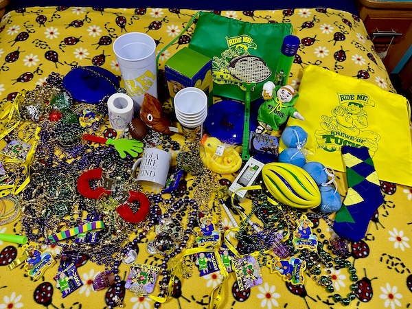 After a 52 Year Mardi Gras Tradition our bed is topped with tons of beads and trinkets from a Mardi Gras parade