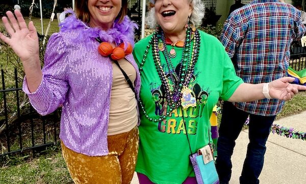 Me and Holly waving and enjoying the 52 Year Mardi Gras Tradition