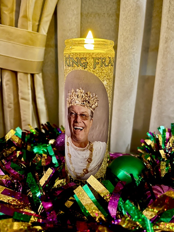 Tall candle in glass with image of chef with crown put me in a Mardi Gras State of Mind