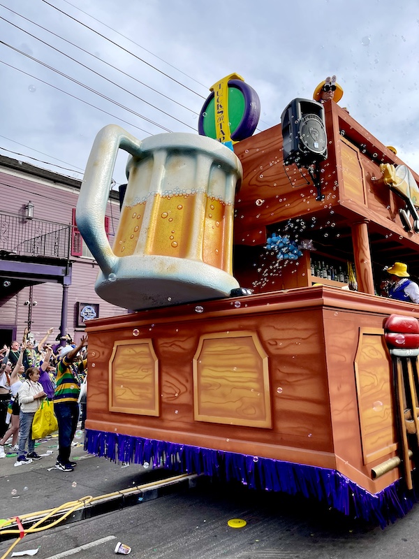 Tucks on tap float with huge mug of beer at Our First Mardi Gras Parade