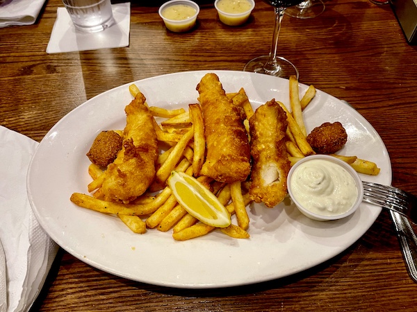 Fish City Grill Pearland TX fish and chips platter on a wood table top