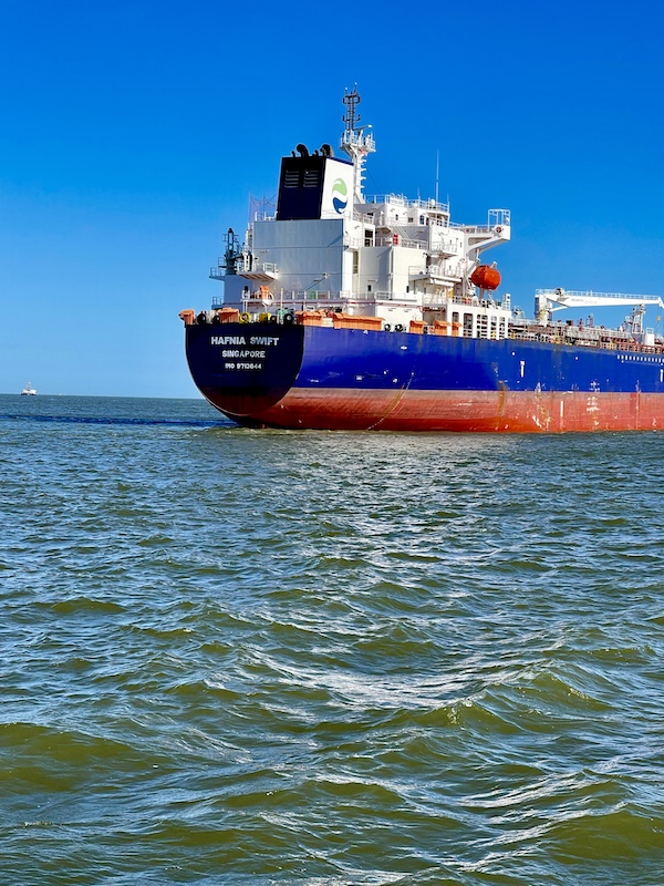 Large red blue and white freighter in Galveston bay seen on our From our Free Galveston Texas Ferry ride