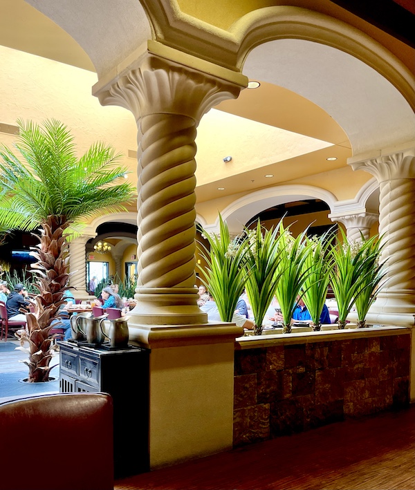 Arches and columns with palm trees enhance the dining room at Abuelo's Mexican Restaurant Midland TX